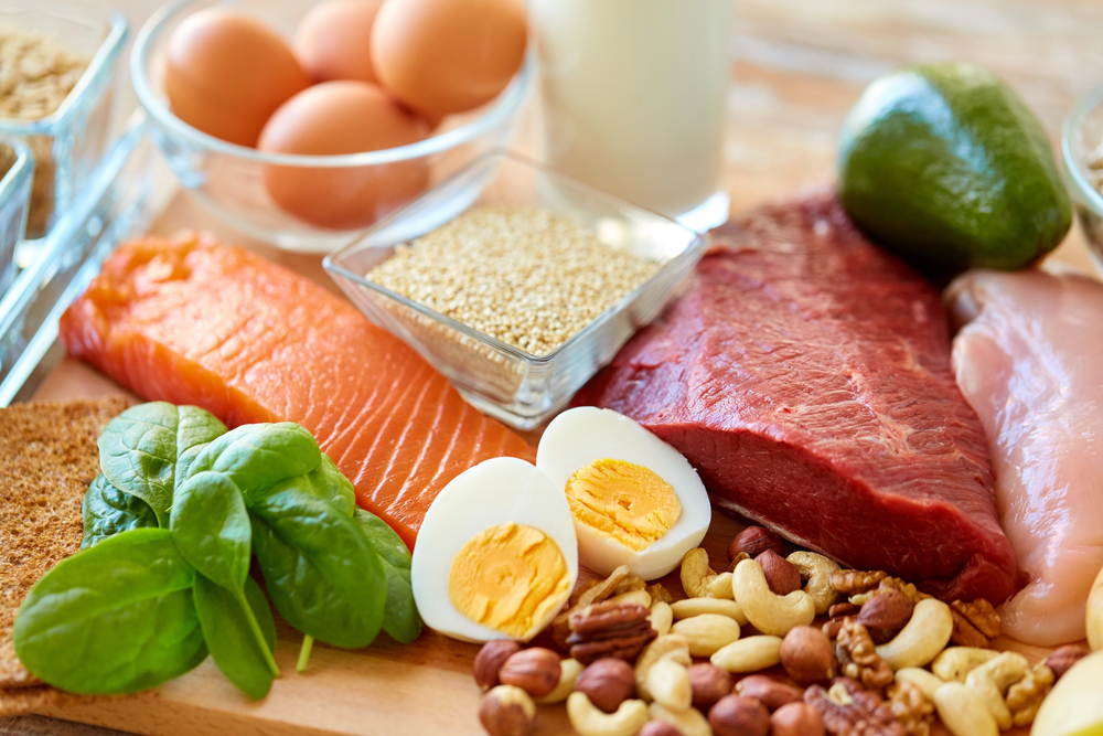 A range of protein-rich foods, including eggs, salmon and nuts loading=